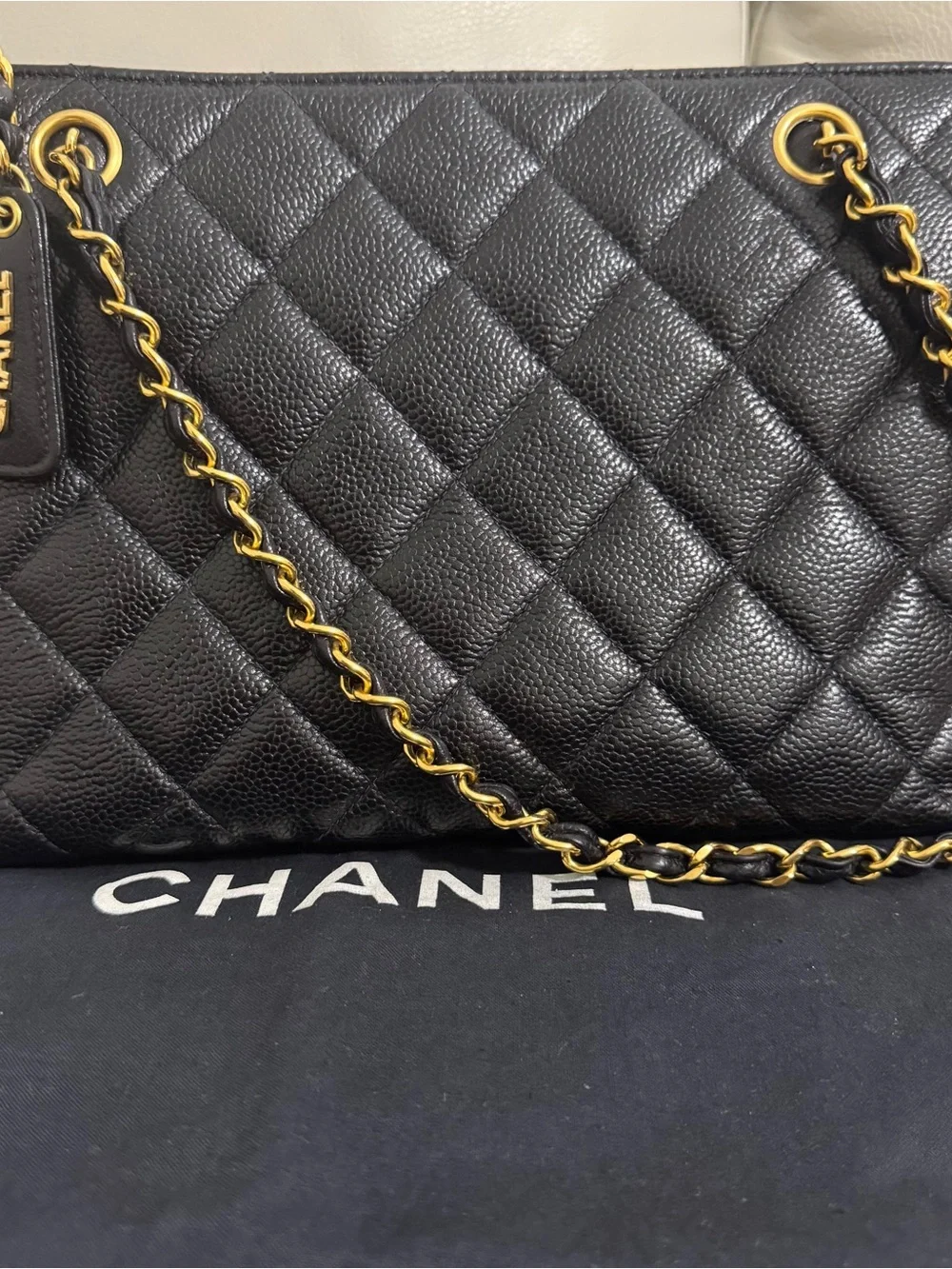 CHANEL VINTAGE Black Quilted Leather Shoulder Bag with 24K GP Chain.